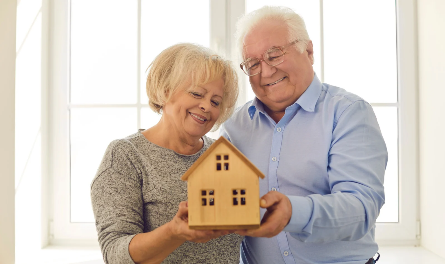 Senior couple purchasing a home with a reverse mortgage